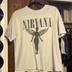 Never worn oversized Nirvana shirt from H&M size is a medium and color is beige